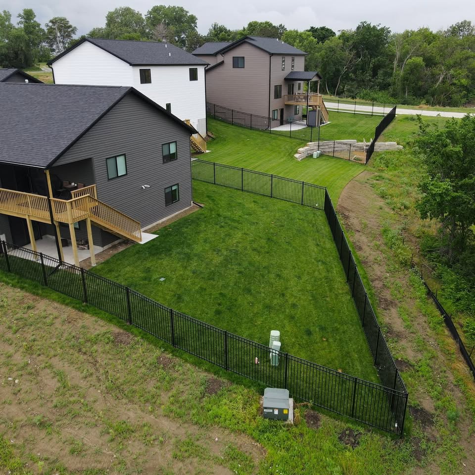 Black ornamental aluminum fence enclosing a Southeast Nebraska property, aerial view, installed by KD Fencing
